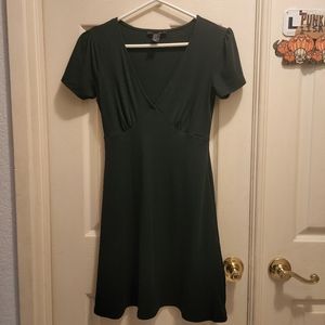 Low-cut green ribbed dress